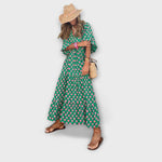 Grünes Maxikleid mit V-Ausschnitt, Puffärmeln und geometrischem Punkte-Muster