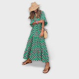 Grünes Maxikleid mit V-Ausschnitt, Puffärmeln und geometrischem Punkte-Muster