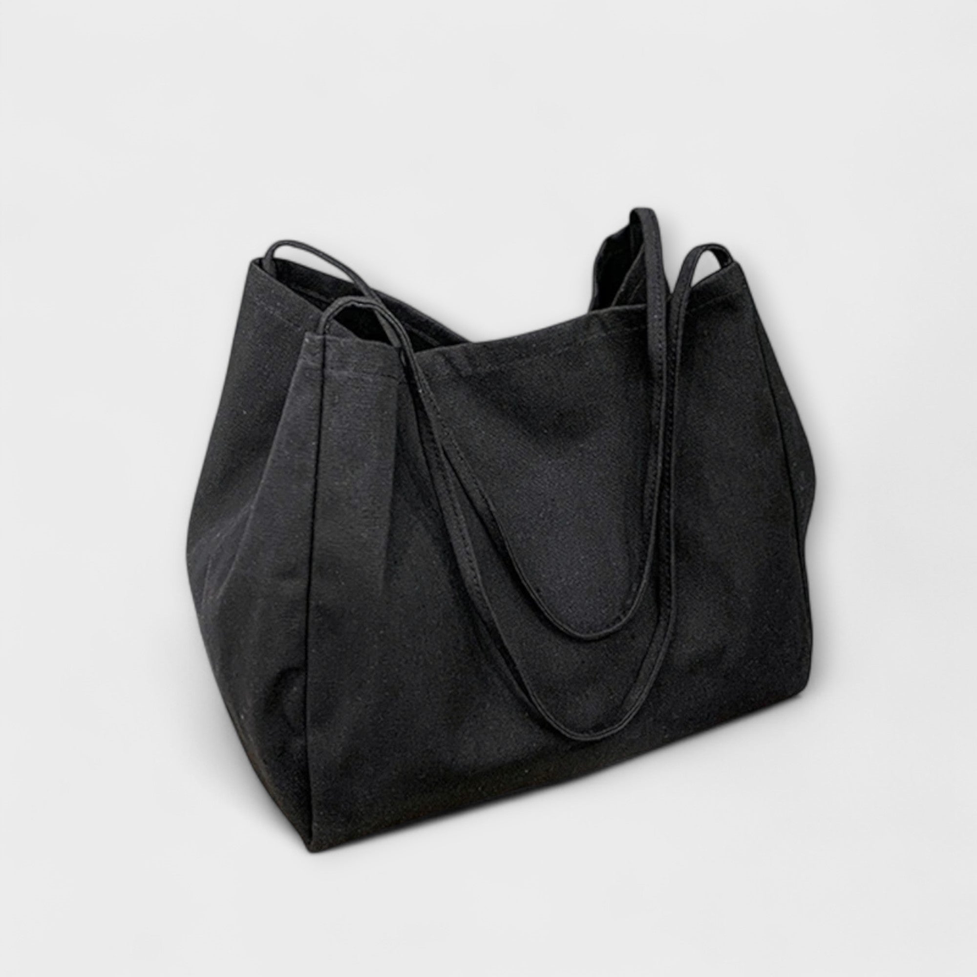 Schwarze Canvas-Tasche mit breiten Henkeln und seitlichen Falten