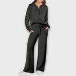 Schwarzes Lounge-Set: Kapuzenhoodie mit Kordel, weite Hose mit Bindeband