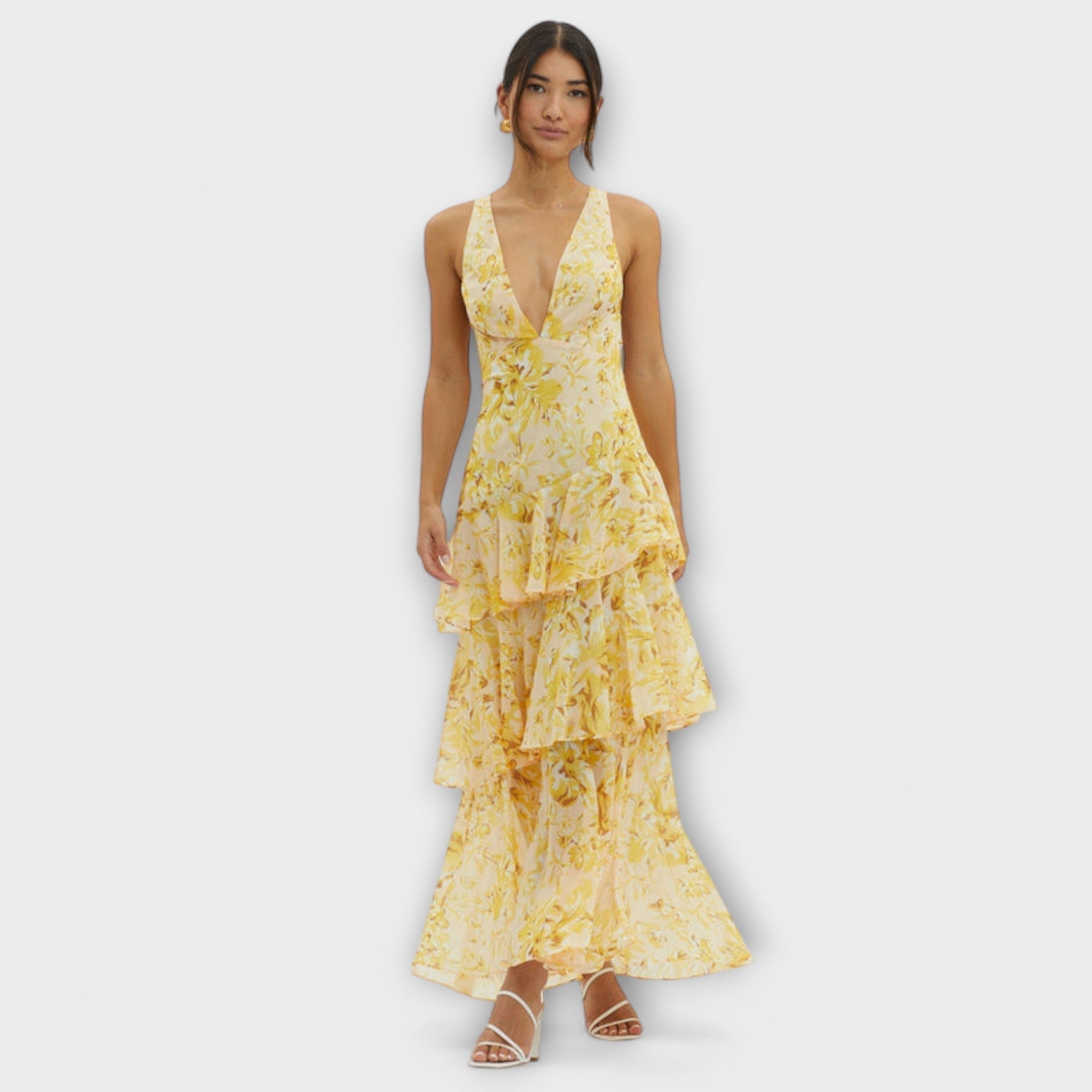 Gelbes Midikleid mit V-Ausschnitt und mehrstufigem Rüschenrock im Blumenmuster