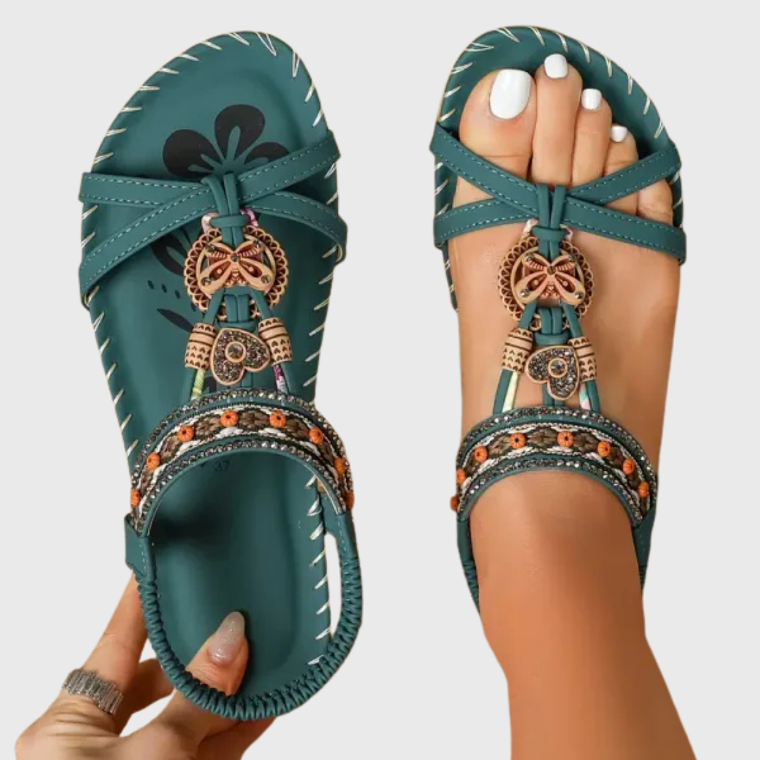 Orthopädische Sandalen in Dunkelgrün mit gekreuzten Riemen und dekorativem Anhänger