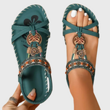 Orthopädische Sandalen in Dunkelgrün mit gekreuzten Riemen und dekorativem Anhänger