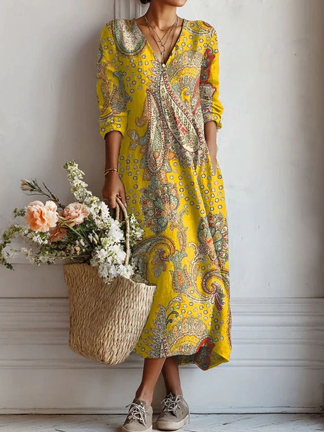 Gelbes Maxikleid mit Paisley-Muster, V-Ausschnitt und langen, leicht ausgestellten Ärmeln