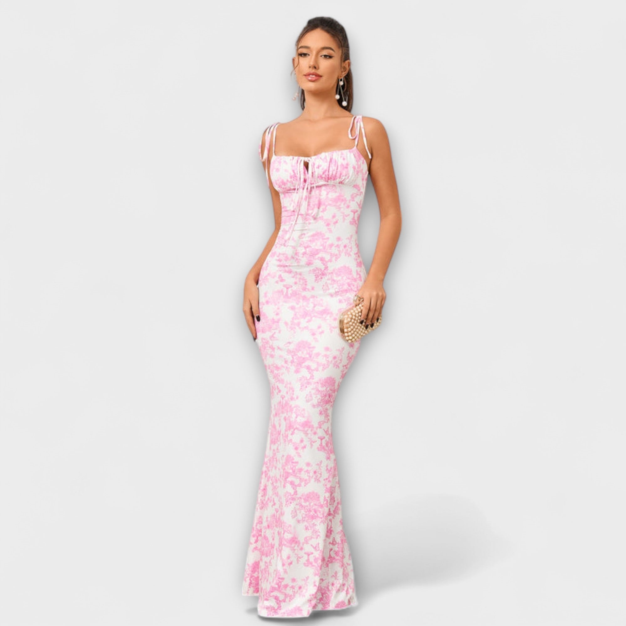 Abendkleid in Hellrosa mit feinem Muster, schmalen Trägern und ausgestelltem Saum