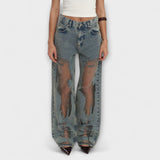 Helle blaue Denim-Jeans mit hoher Taille und großflächigen Burnout-Details vorn