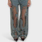 Helle blaue Denim-Jeans mit durchscheinenden Burnout-Parts an den Oberschenkeln