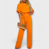 Oranger Jumpsuit mit weiten Beinen, Bindebund in der Taille und kurzer, weicher Ärmelpartie