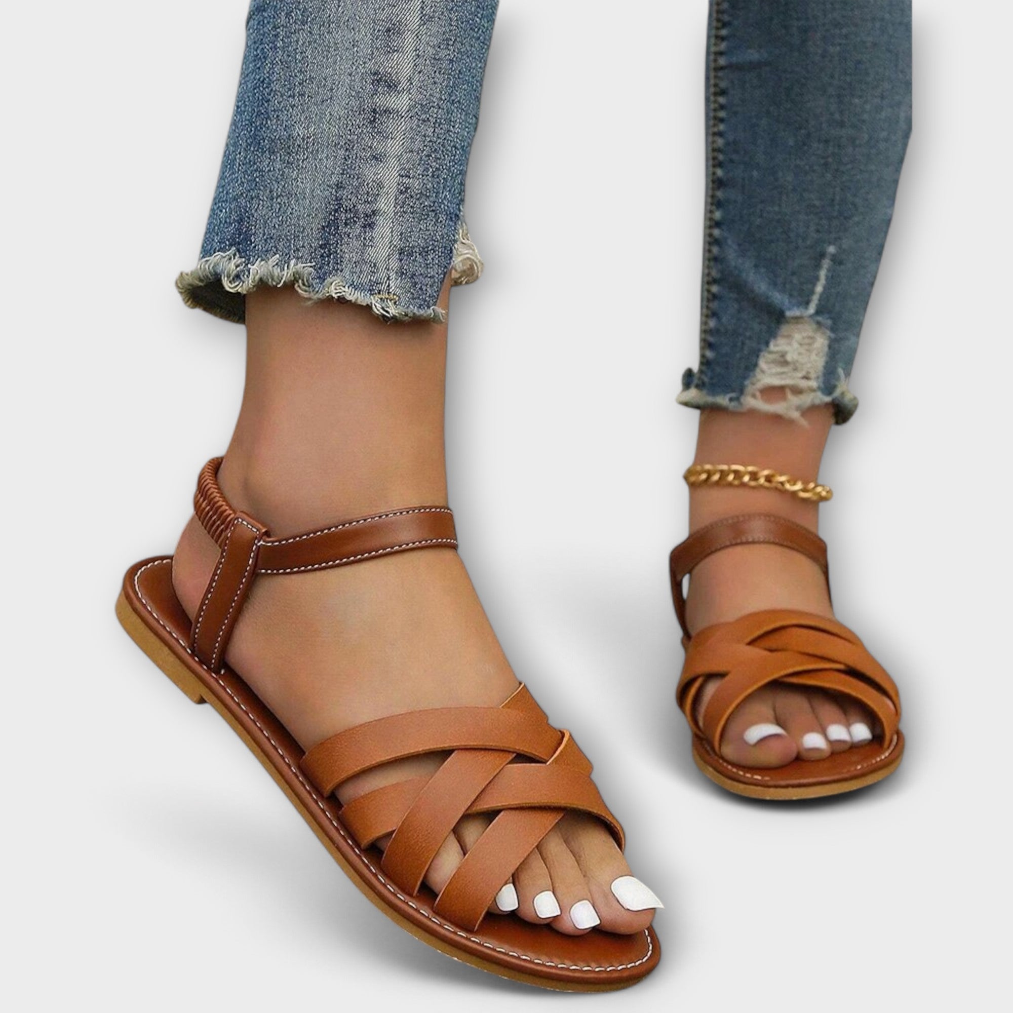 Braune Sandalen mit gekreuzten Riemen und offener Zehenpartie, braune Laufsohle