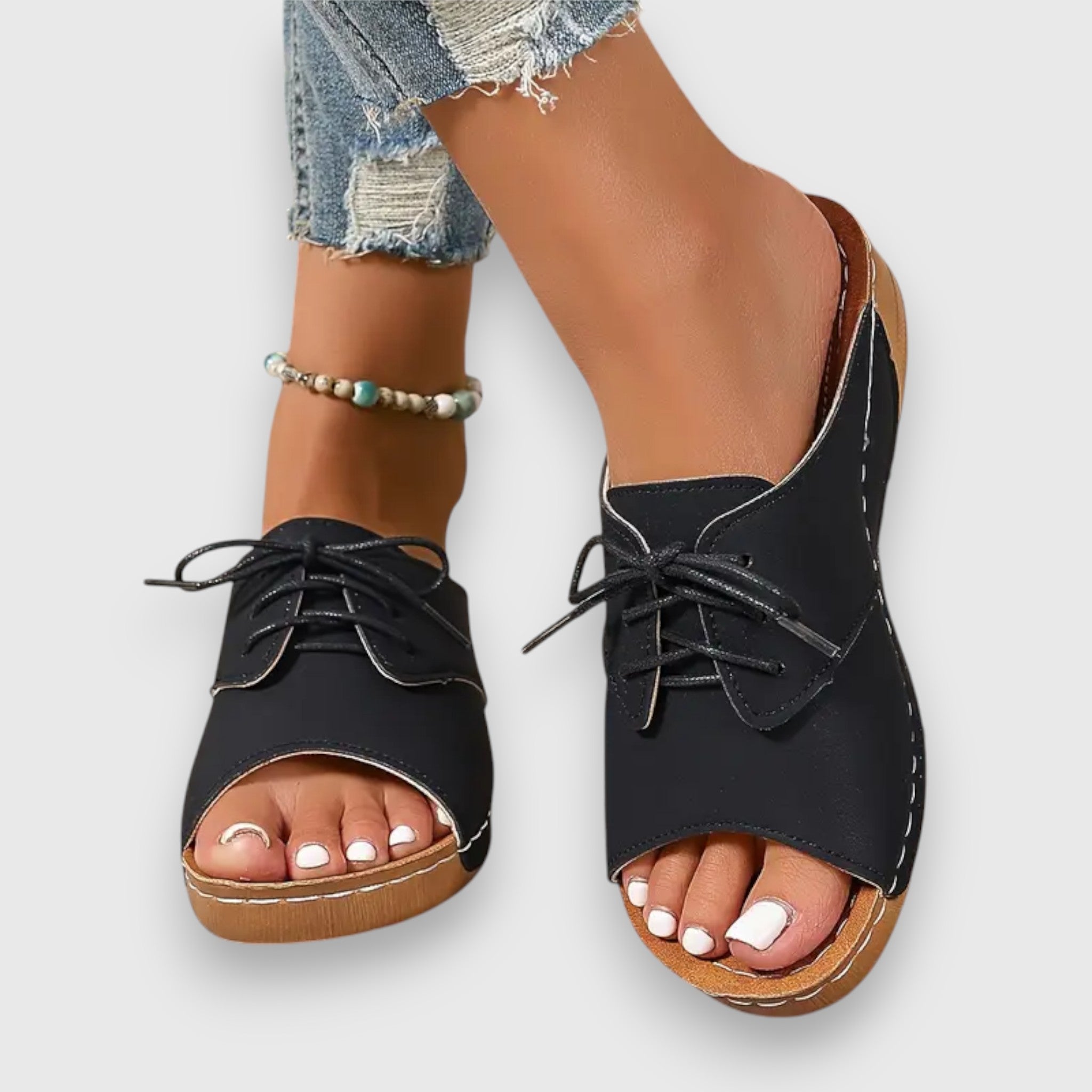 Schwarze Vintage-Stil Sandalen mit Schnürung, offener Zehenpartie und brauner Sohle