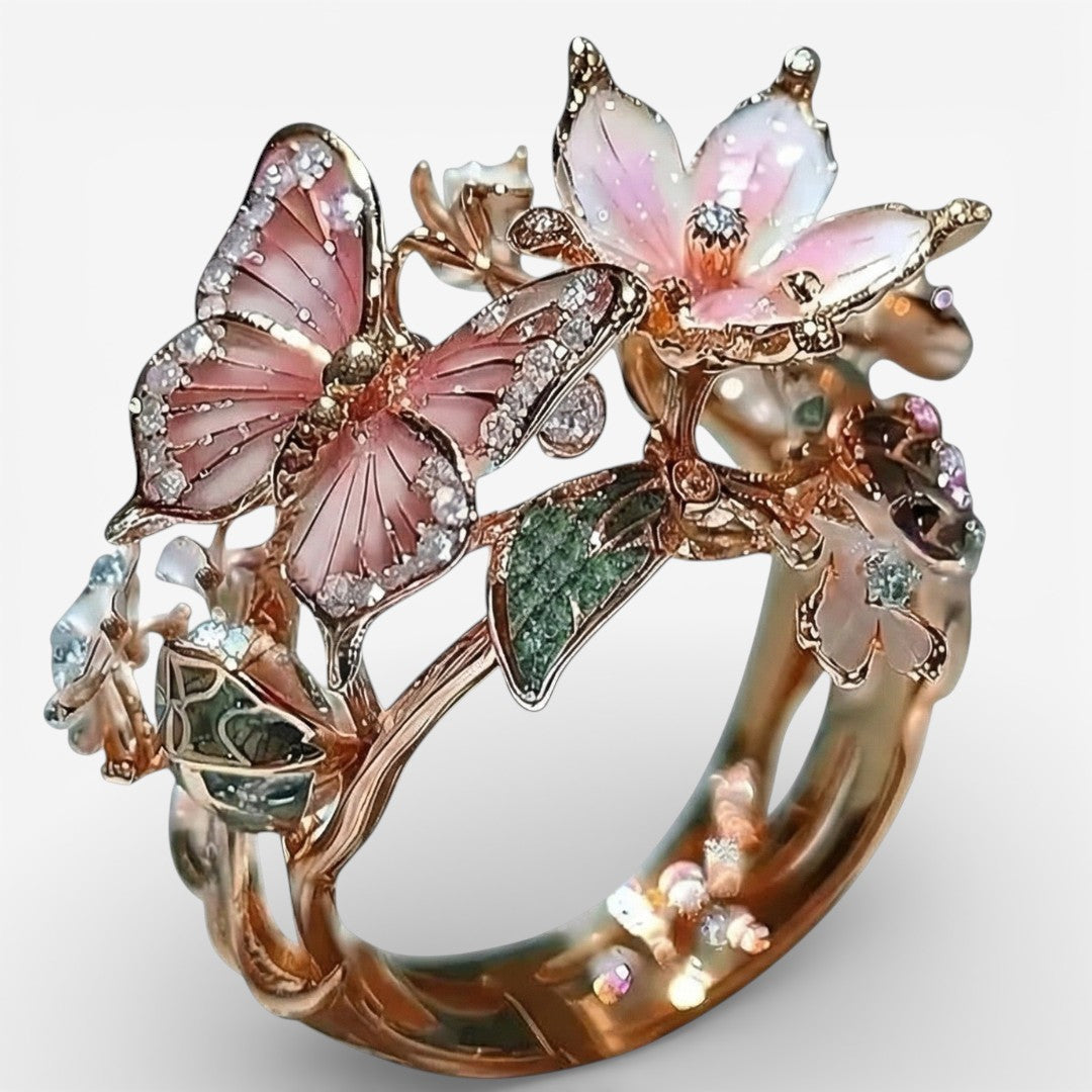 Schmetterlingsring in Roségold mit rosa Emaille und funkelnden Zirkonia-Steinen
