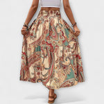 Schwingender Rock mit Paisley-Muster auf beigem Grund, elastischer Bund, weit fallend