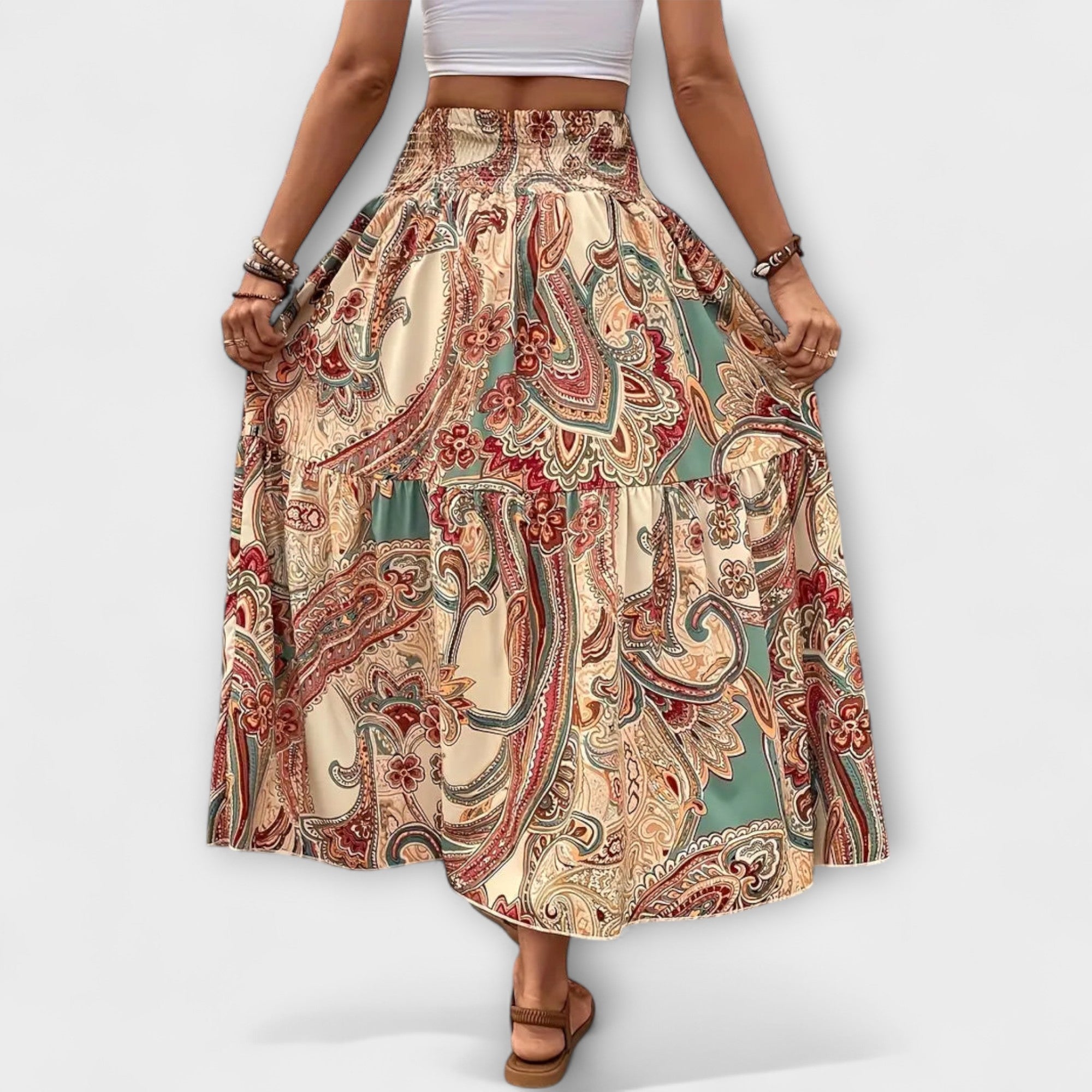 Schwingender Rock mit Paisley-Muster auf beigem Grund, elastischer Bund, weit fallend