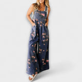 Weite Denim-Latzhose mit Blumenmuster und schmalen Trägern, hellblauer Denimstoff