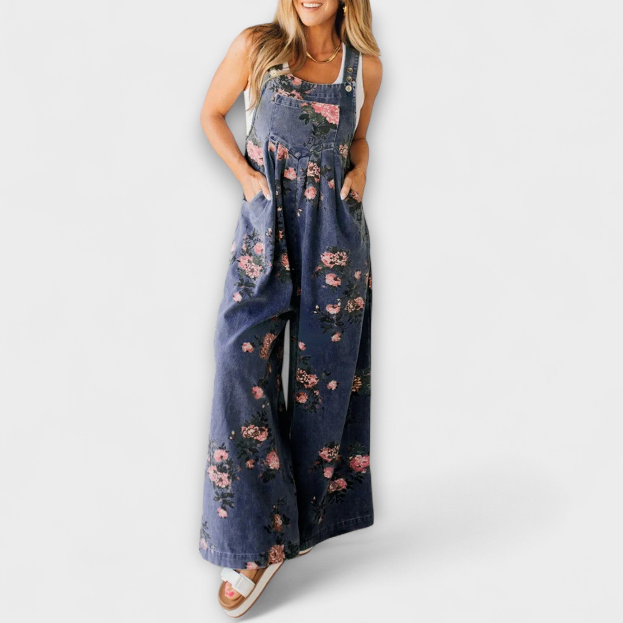 Weite Denim-Latzhose mit Blumenmuster und schmalen Trägern, hellblauer Denimstoff