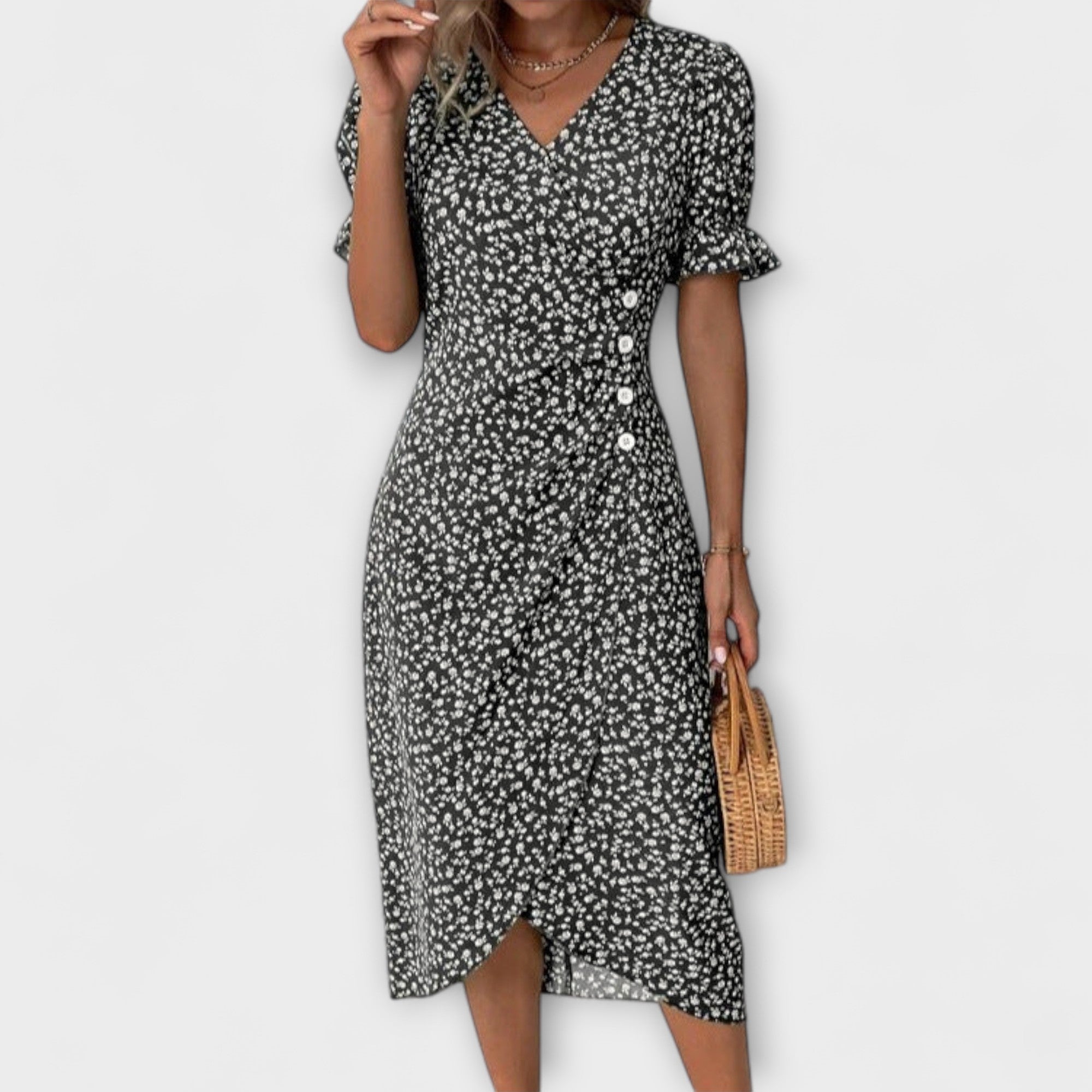 Sommerkleid mit V-Ausschnitt, schwarzem Stoff und weißem Blümchenmuster, Knielänge