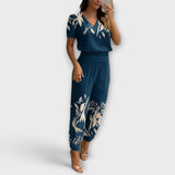 Elegantes Set mit Oberteil und Hose, blaues Blumenmuster, V-Ausschnitt, locker fallende Hosenbeine