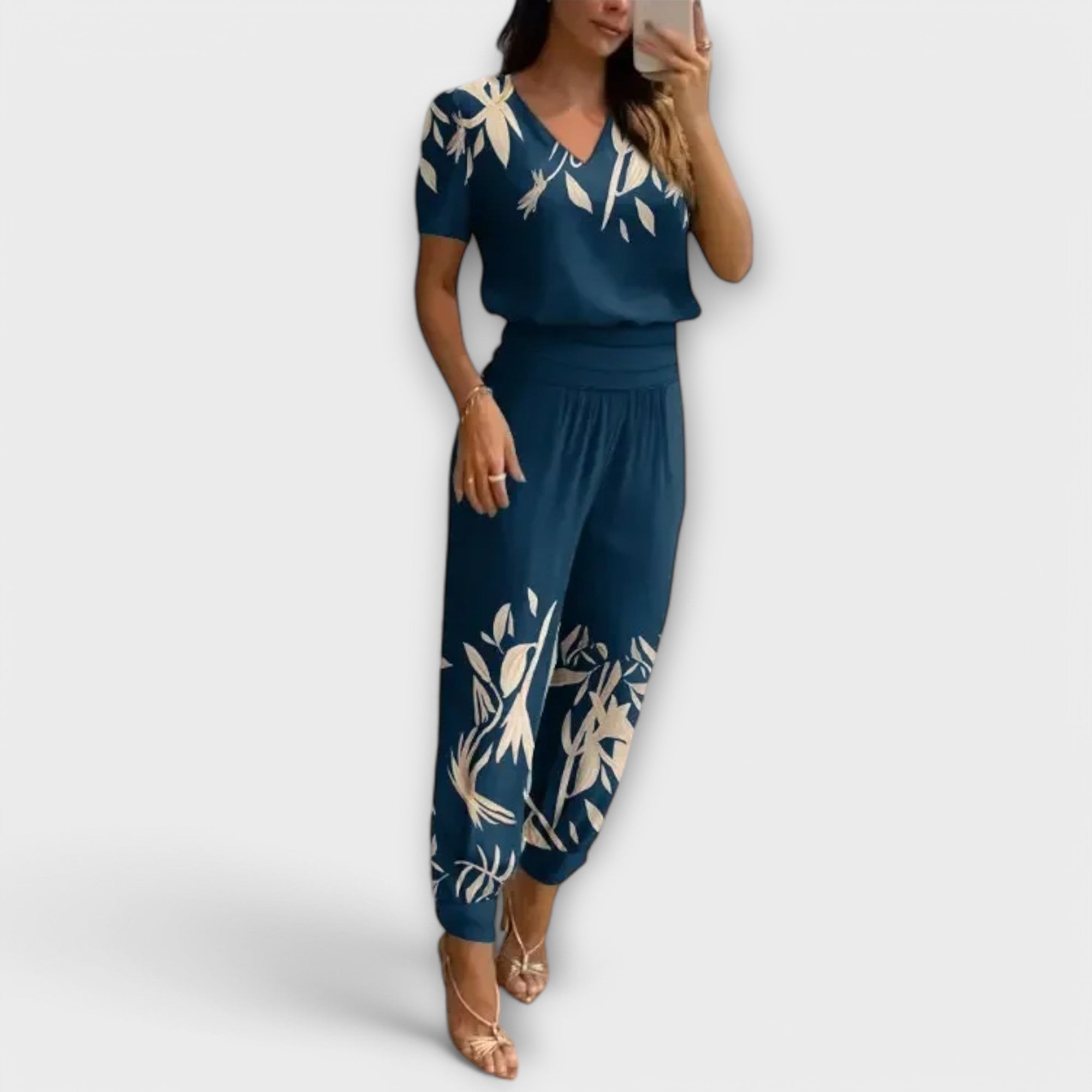 Elegantes Set mit Oberteil und Hose, blaues Blumenmuster, V-Ausschnitt, locker fallende Hosenbeine