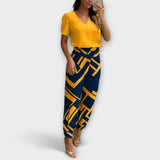 Elegantes Set mit Oberteil und Hose, gelbes Oberteil und dunkelblaue Hose mit Grafikmuster