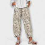 Bequeme bedruckte Hose mit floralen Motiven, hellbeige, weitem Bein und Knöchellänge