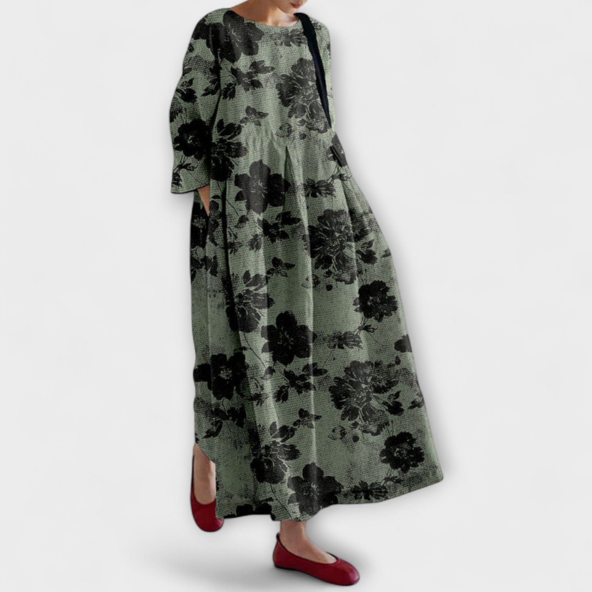 Olivgrünes Kleid mit schwarzem Blumenmuster, weitem Schnitt und langen Ärmeln