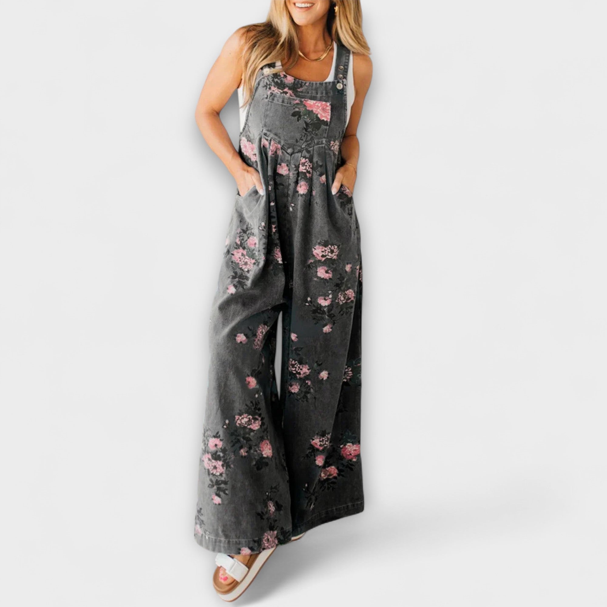 Weite Denim-Latzhose mit Blumenmuster und schmalen Trägern, dunkler Denimstoff