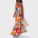 Schulterfreies Maxi-Kleid mit farbenfrohem Blumenmuster und fließendem Rocksaum