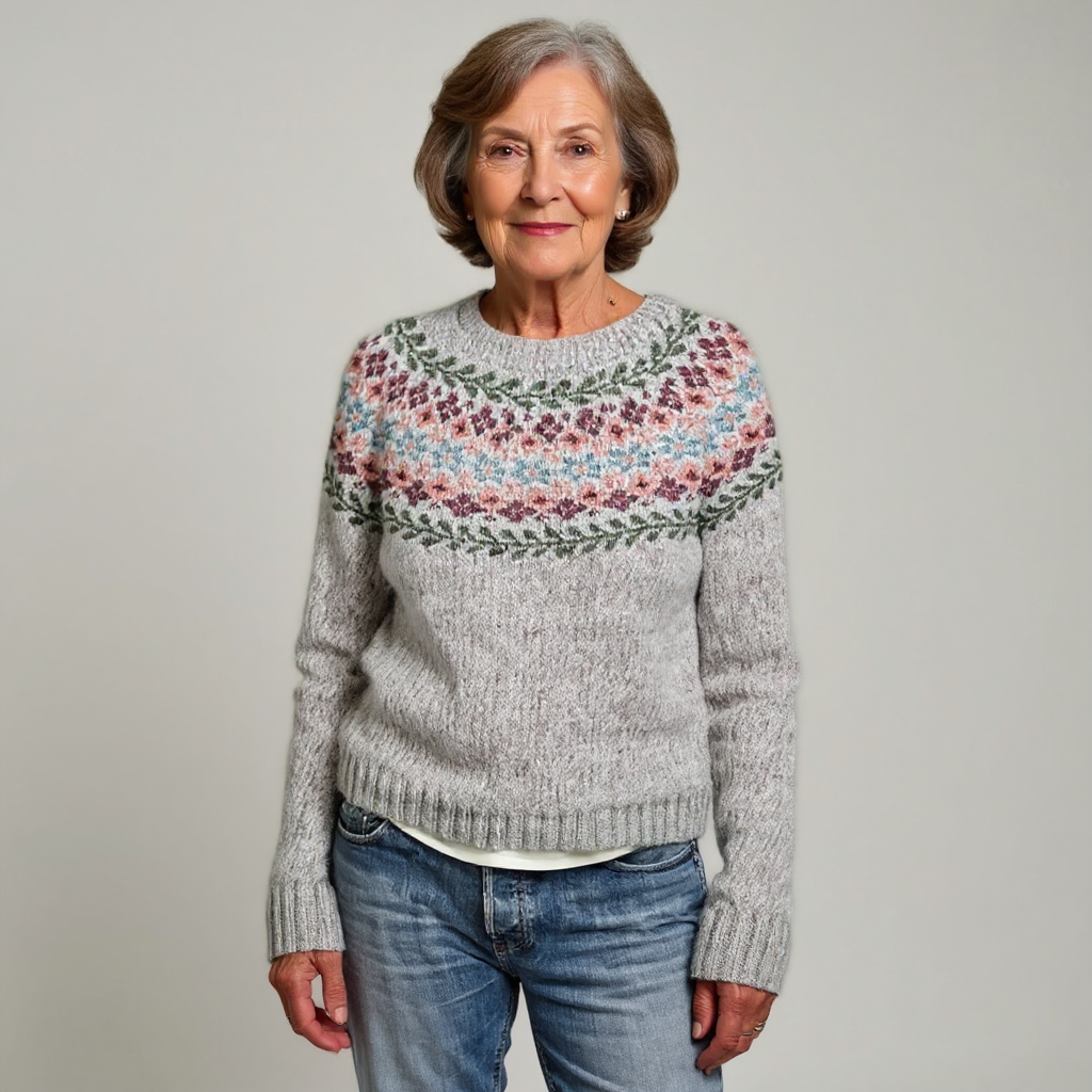 Grauer Strickpullover mit Rundhals und buntem Norweger-Muster am Bund