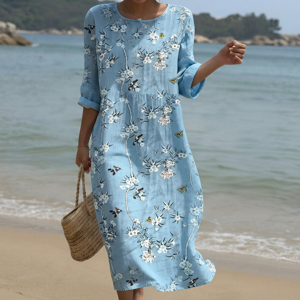 Hellblaues Maxikleid mit Rundhalsausschnitt und Blumenprint, ausgestellter Schnitt