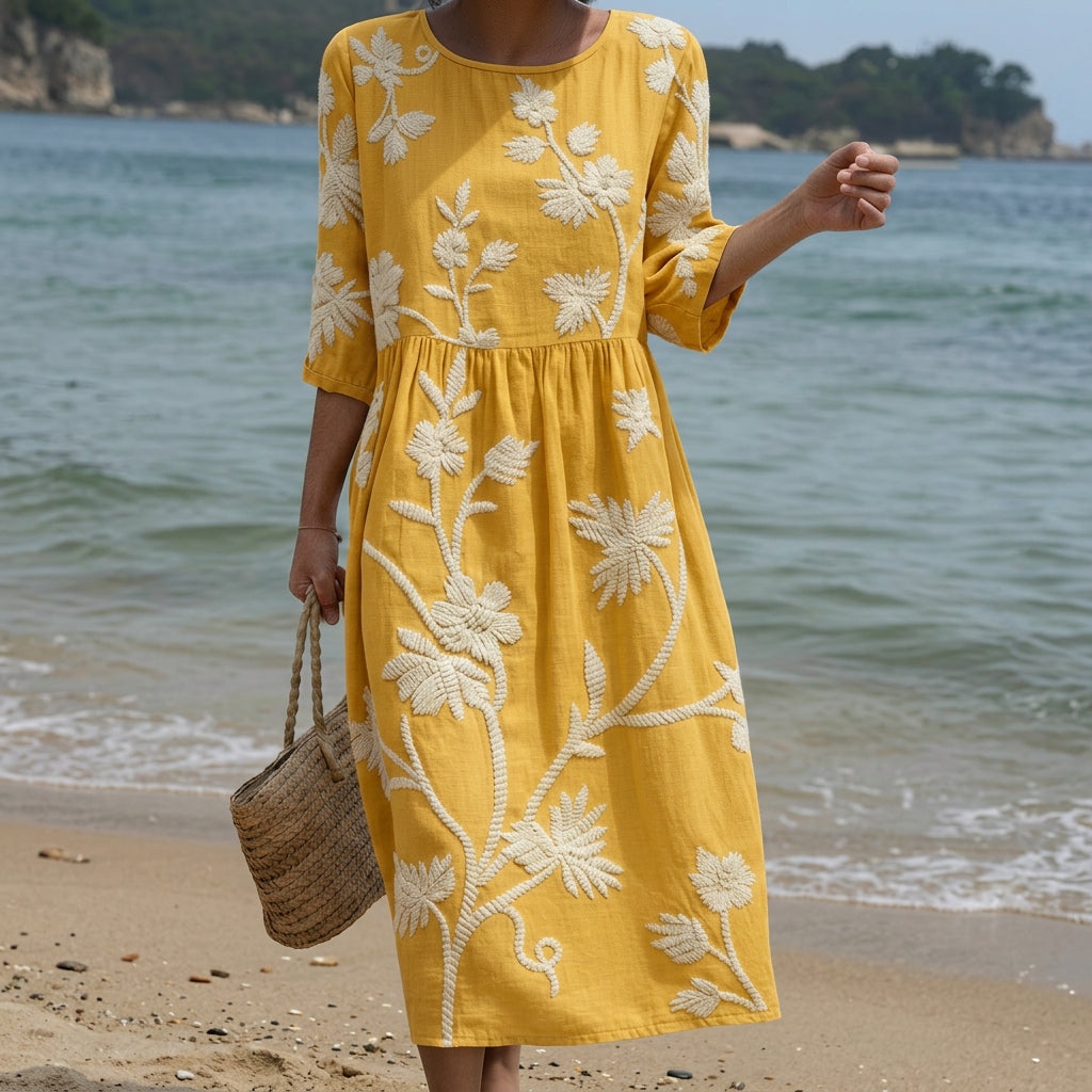 Gelbes Midi-Kleid mit weißen Pflanzen- und Blumenmuster, lange Ärmel, Rundhalsausschnitt