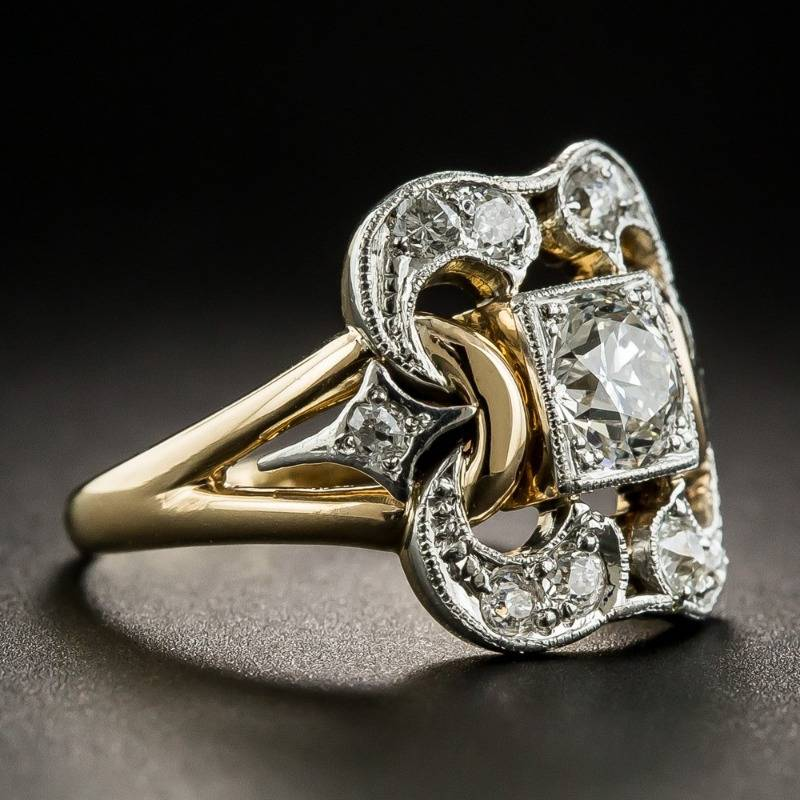 Zirkonia-Ring mit rechteckigem Stein und runden Details, gold-silberne Fassungen