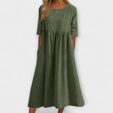Dunkelgrünes Damenkleid mit Rundhalsausschnitt, 3/4-Ärmeln und gerafftem Rock